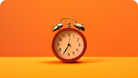 red-alarm-clock-yellow-orange-background